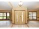 Bright foyer with large windows, tile flooring, and neutral walls, creating an airy and welcoming entrance to the home at 68 Spring Lake Dr, Debary, FL 32713