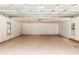 Spacious, unfinished two-car garage with concrete flooring, windows, and ample room for parking and storage at 68 Spring Lake Dr, Debary, FL 32713