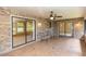Spacious brick patio featuring ceiling fans and sliding glass doors at 68 Spring Lake Dr, Debary, FL 32713