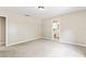 Spacious bedroom with neutral colors, carpet flooring, and an attached bathroom entrance at 688 Cumberland Rd, Deland, FL 32724