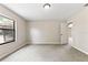 Well-lit bedroom with neutral walls, carpet flooring, and a window offering natural light at 688 Cumberland Rd, Deland, FL 32724