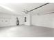 Clean, spacious garage with a utility sink, water heater, and garage door opener at 688 Cumberland Rd, Deland, FL 32724