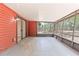 Spacious screened lanai with red wood panels and views of the backyard at 688 Cumberland Rd, Deland, FL 32724