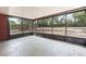 Enclosed lanai offering a tranquil outdoor space with screens and a concrete floor at 688 Cumberland Rd, Deland, FL 32724