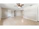 Bright living room with tile floors, ceiling fan, and neutral paint providing a versatile living space at 688 Cumberland Rd, Deland, FL 32724