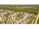 An aerial view showcases the community's serene lakes and lush landscaping at 6917 Vintage Ln, Port Orange, FL 32128