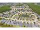 Expansive aerial view of a community featuring lush landscaping and multiple ponds at 6917 Vintage Ln, Port Orange, FL 32128