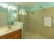 Modern bathroom featuring a walk-in shower and vanity at 6917 Vintage Ln, Port Orange, FL 32128