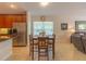 Cozy dining area adjacent to the kitchen with great natural light and comfortable seating at 6917 Vintage Ln, Port Orange, FL 32128