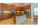 Well-equipped kitchen with granite countertops, stainless steel appliances, and wood cabinets at 6917 Vintage Ln, Port Orange, FL 32128