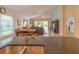 Open floor plan showcasing the living room and kitchen in a bright and airy space at 6917 Vintage Ln, Port Orange, FL 32128