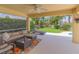 Relaxing screened-in patio with comfortable seating and views of the lush backyard at 6917 Vintage Ln, Port Orange, FL 32128