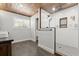 Bathroom with walk-in shower, stone floor, wooden ceiling and window at 793 Timothy St, Ormond Beach, FL 32174