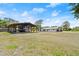Spacious property featuring a carport, house, and garage at 793 Timothy St, Ormond Beach, FL 32174