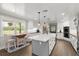 Modern kitchen showcasing an island, stainless steel appliances, and hardwood floors at 793 Timothy St, Ormond Beach, FL 32174