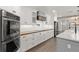 Spacious kitchen featuring stainless steel appliances, a large island, and wood floors at 793 Timothy St, Ormond Beach, FL 32174