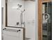 Walk-in shower with subway tile, glass door and stone flooring at 793 Timothy St, Ormond Beach, FL 32174