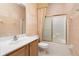 Bathroom with tile floors, vanity, toilet, and shower with a curtain at 8231 Sw 79Th Ct, Ocala, FL 34476