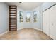 Bright bedroom with tile floors, built-in shelving, three windows and closet at 8231 Sw 79Th Ct, Ocala, FL 34476