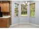 Bright dining nook with bay windows offering natural light and tile floors at 8231 Sw 79Th Ct, Ocala, FL 34476