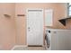 Laundry room features a washer, and hooks for coats at 8231 Sw 79Th Ct, Ocala, FL 34476