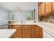 View of an open living space with breakfast bar, natural light, and tile flooring at 8231 Sw 79Th Ct, Ocala, FL 34476