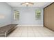 Open-concept living area with tile flooring, ceiling fan, and natural light from windows at 8231 Sw 79Th Ct, Ocala, FL 34476