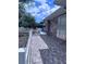 Brick home with a brick walkway enclosed with white picket fence on a sunny day at 891 S Atmore Cir, Deltona, FL 32725
