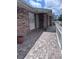 Brick home with a brick walkway enclosed with white picket fence on a sunny day at 891 S Atmore Cir, Deltona, FL 32725