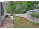 Fenced backyard with storage shed and mature trees at 941 Village Lake N Dr, Deland, FL 32724