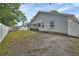 Back exterior of home, featuring fenced backyard and screened patio at 941 Village Lake N Dr, Deland, FL 32724