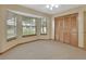 Bright bedroom featuring a closet and windows at 941 Village Lake N Dr, Deland, FL 32724