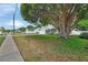 Attractive single-story home features an attached two-car garage, large front yard, and mature shade trees at 941 Village Lake N Dr, Deland, FL 32724