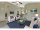 Cozy living room features neutral walls, carpet, and comfortable seating at 941 Village Lake N Dr, Deland, FL 32724