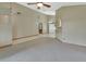 Spacious living room has tile flooring near archway to kitchen at 941 Village Lake N Dr, Deland, FL 32724