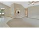 Spacious living room shows archway feature to kitchen at 941 Village Lake N Dr, Deland, FL 32724