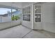 Screened outdoor patio with concrete floor, offering a view of the fenced yard at 941 Village Lake N Dr, Deland, FL 32724