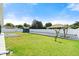 Wide backyard featuring a well-maintained lawn, a storage shed, and privacy fencing at 979 Leyburn Dr, Deltona, FL 32725