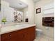 Clean bathroom featuring a vanity with a sink, a toilet, and a shower with a curtain at 979 Leyburn Dr, Deltona, FL 32725