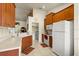 Bright kitchen with ample counter space, wooden cabinetry, and appliances at 979 Leyburn Dr, Deltona, FL 32725