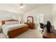 Serene main bedroom features tile floors, a ceiling fan, and an ensuite bathroom at 979 Leyburn Dr, Deltona, FL 32725