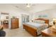 Comfortable main bedroom showcasing tile flooring, natural light, and a view of the ensuite at 979 Leyburn Dr, Deltona, FL 32725