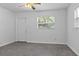 Cozy bedroom with a ceiling fan, neutral walls, and bright natural light creating a simple and inviting space at 706 W Franklin Ave, Deland, FL 32720