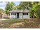 Charming single-story home with a well-maintained lawn and classic architectural details, creating a welcoming curb appeal at 706 W Franklin Ave, Deland, FL 32720