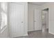 Hallway with fresh paint, natural light from the window, and easy access to other rooms at 706 W Franklin Ave, Deland, FL 32720