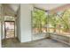Enclosed porch with a view of the green backyard at 706 W Franklin Ave, Deland, FL 32720