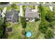 Aerial view of a home with a large backyard, pool, and a playground at 10 Foxhunter Flt, Ormond Beach, FL 32174