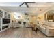 Spacious finished basement with a fireplace, entertainment center, and wood flooring at 10 Foxhunter Flt, Ormond Beach, FL 32174