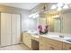Bathroom with double sink vanity and tiled floors at 10 Foxhunter Flt, Ormond Beach, FL 32174