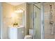 Modern bathroom features a glass-enclosed shower and a pristine vanity with ample lighting at 10 Foxhunter Flt, Ormond Beach, FL 32174